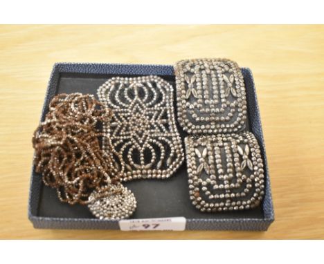 A small selection of cut steel including belt buckle, shoe buckles, button and chain