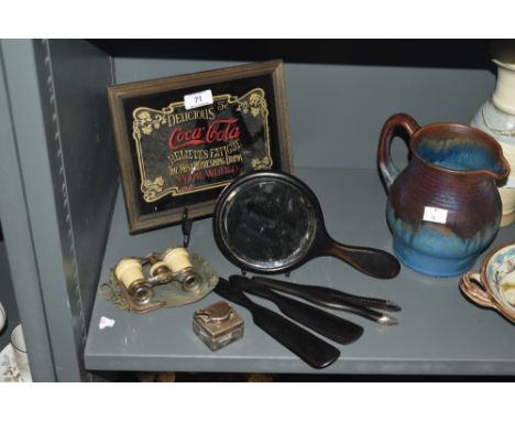 A mid-20th Century Coca-Cola advertising mirror, measuring 18cm x 22cm overall, together with a four piece ebonised wood dres