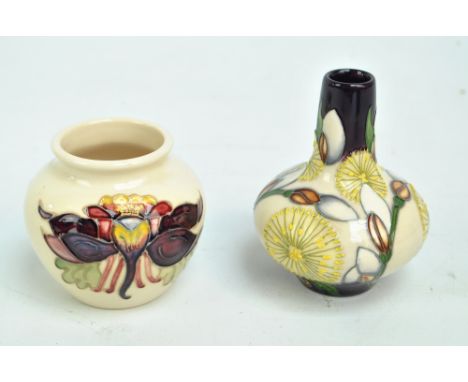 MOORCROFT; a tubeline decorated bottle vase with yellow flowers on a cream and purple ground by Kerry Goodwin, impressed mark