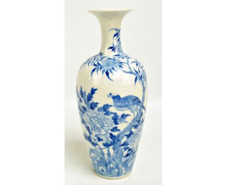 A late 19th/early 20th century Chinese porcelain baluster vase with flared rim, painted with flora and fauna in underglaze bl