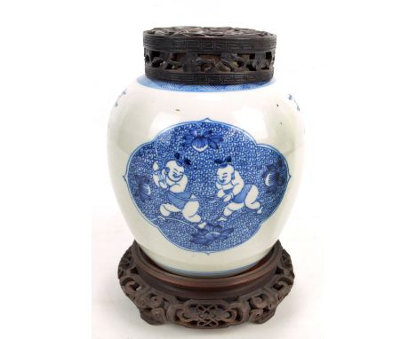 A 19th century Chinese porcelain ginger jar painted in underglaze blue with two opposing shaped panels depicting two boys pla