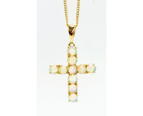 A 9ct yellow gold fine link chain supporting an opal cross pendant, approx 3.7g.