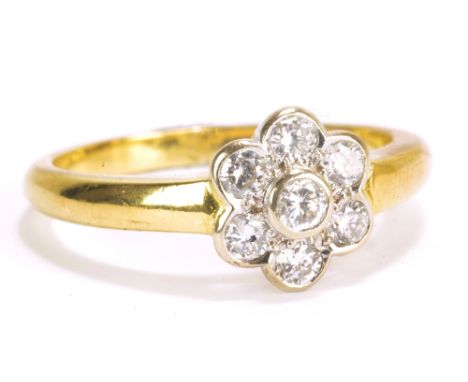 An 18ct yellow gold and diamond seven stone cluster ring, size O, approx 5.15g.