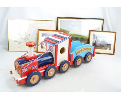 A wooden model steam engine titled 'Britannia' and painted in Union Jack colours, length 91.5cm, fourteen coloured prints of 