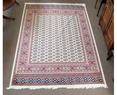 A beige ground Bokhara carpet, 280 x 200cm.