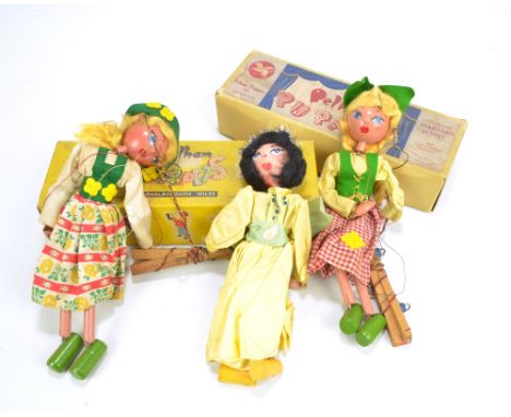 Two boxed Pelham puppets, 'Dutch Girl' and 'Tyrolean Girl', and a further similar puppet (3).