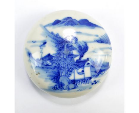 A Chinese porcelain circular paste box painted with architectural and mountainous landscape to the lid and with orchard to th