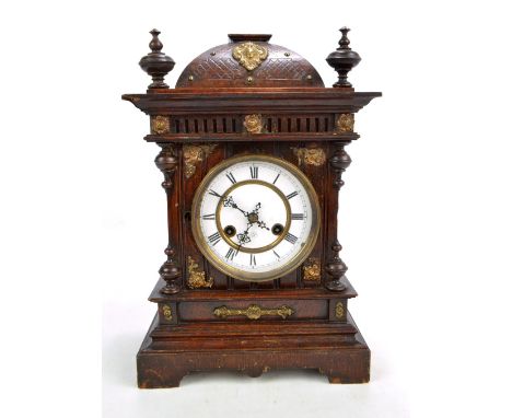 A Junghans oak mantel clock, the circular dial set with Roman numerals, height approx 41cm (af). CONDITION REPORT: There's a 