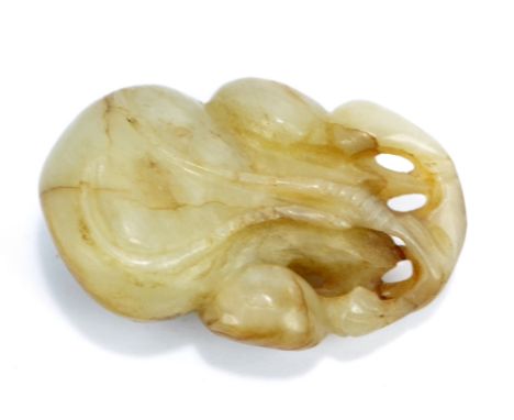 A Chinese carved jade fruit with pale brown inclusions and natural crazing, height 5cm.