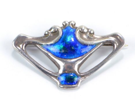 CHARLES HORNER; an Art Nouveau Edward VII hallmarked silver, blue and green enamel detailed brooch of scroll design, Chester 