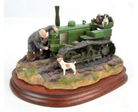 BORDER FINE ARTS; figure group 'Starts First Time', modelled as a farmer with terriers starting a tractor, with certificate, 