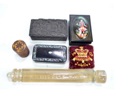 An Irish bog oak rectangular snuff box, a Victorian papier-mâché mother of pearl inlaid snuff box, a Russian lacquered box an