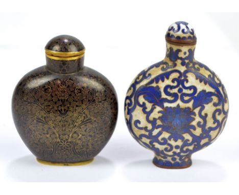 A late 19th century Chinese blue and white cloisonné enamel decorated snuff bottle of flat circular form depicting flower hea