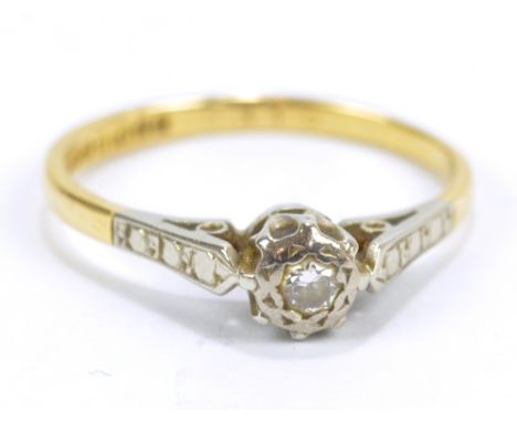 An 18ct yellow gold illusion set diamond solitaire ring, size L 1/2, approx 2.1g.