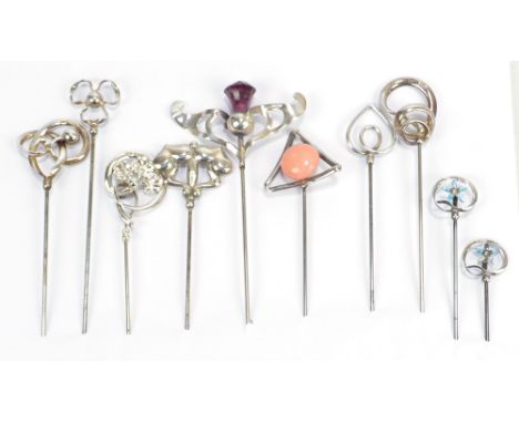 CHARLES HORNER; ten variously hallmarked silver hat pins including blue enamel floral and looping ribbon pair stamped 'Sterli