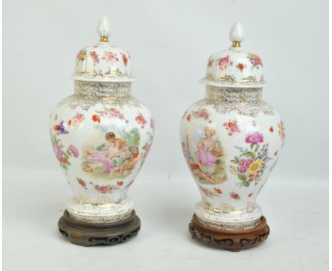 A pair of gilt and floral decorated baluster vases and covers, height 38cm (2). CONDITION REPORT: Rubbing to gilding and ligh