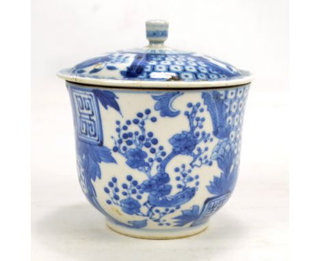 A Chinese porcelain bell shaped jar and cover painted with two opposing panels of blossoming branches and floral sprays, each