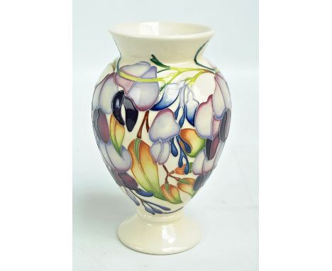 MOORCROFT; a tubeline decorated baluster vase with hanging flowers by Emma Bossons, numbered 113, impressed marks to base, da