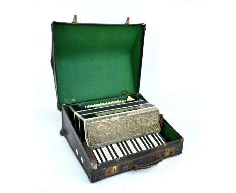A cased Italian Pancotti Jedson accordion with three instruction booklets.
