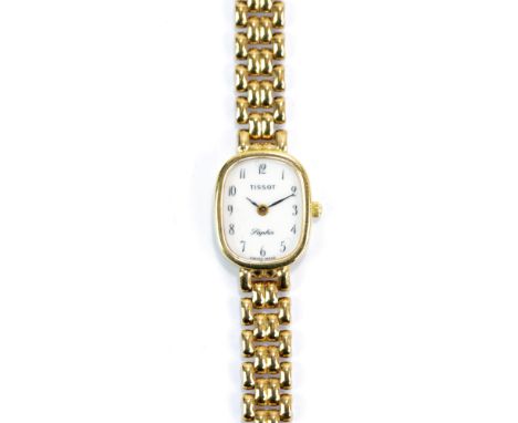 TISSOT; a lady's 9ct yellow gold quartz 'Saphir' dress watch, the oval dial set with Arabic numerals, diameter 1.3cm, on inte
