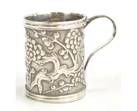 WANG HING (probably); a late 19th/early 20th century Chinese Export silver mustard pot decorated in relief with blossoming pr