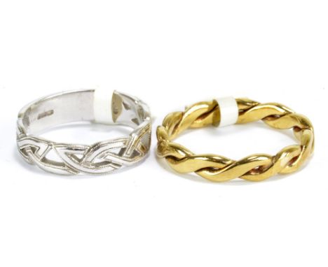 A 9ct yellow gold interwoven ring, size U 1/2, and a 9ct white gold Celtic design ring, size P, combined approx 8.2g (2).