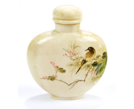 A 19th century Chinese ivory snuff bottle of flat ovoid form, engraved and painted with a bird perched on blossoming branch t