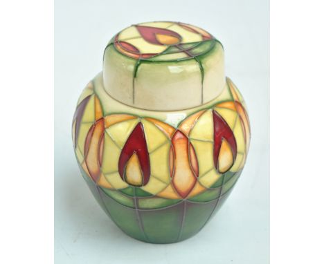 MOORCROFT; a tubeline decorated 'Candle Glow' pattern ginger jar and cover by Nicola Slaney, impressed marks to base, dated 2