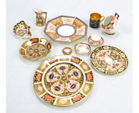 A group of Royal Crown Derby Imari items including sugar scuttle, miniature cream jug, miniature teacup and two saucers and f