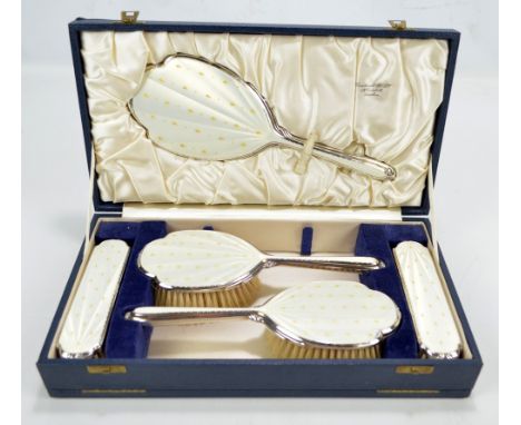 ALBERT CARTER; a cased Elizabeth II hallmarked silver and enamel backed five piece dressing table set, Birmingham 1955, the s