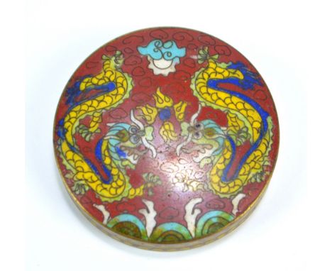 A 19th century Chinese cloisonné enamel circular paste box decorated with two confronting dragons chasing the Pearl of Wisdom