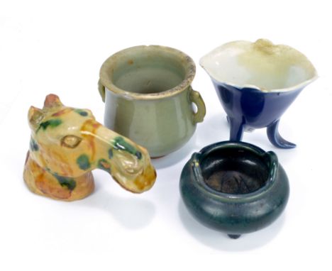 A Chinese Sancai glazed horse's head, height 11cm, a celadon glazed twin handled cup, possibly Song Dynasty, height 7cm (af),