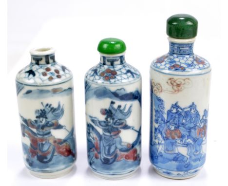 A pair of 19th century Chinese porcelain cylindrical snuff bottles painted in underglaze blue and red with confronting warrio