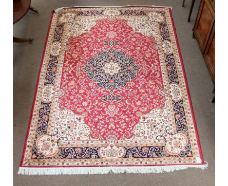 A red ground Keshan carpet, 280 x 200cm.