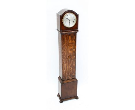 An early 20th century oak longcase clock of small proportions, the silvered dial set with Arabic numerals, height 135cm.