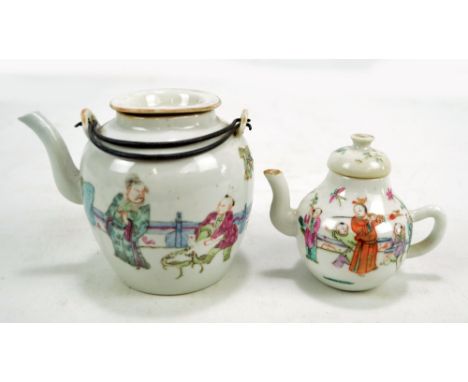 A 19th century Chinese Famille Rose porcelain teapot of squat baluster form with loop handle, length 10.5cm and a further sim