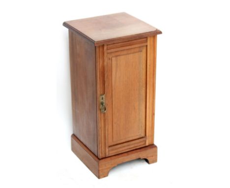 A walnut pot cupboard on bracket feet, height 74cm.