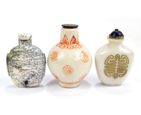 A Chinese crackle glaze porcelain snuff bottle of globular form with cylindrical neck, painted with chrysanthemum heads throu