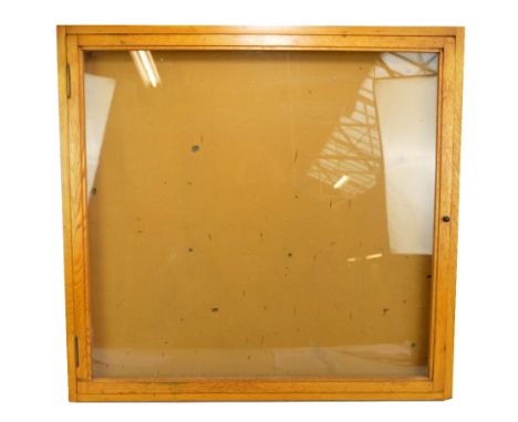 A large light oak wall mounted display cabinet with hinged glazed front, 78 x 84cm.