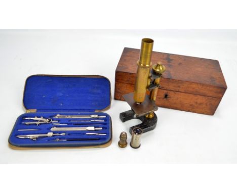 A cased Leitz Wetzlar microscope no.13960 with eyepiece and objective lenses, height 24cm, and a cased set of Philmerco drawi