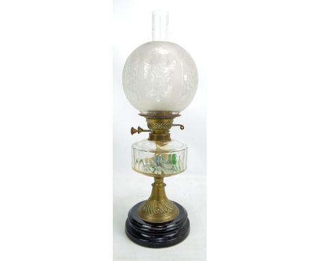 A late Victorian oil lamp with clear glass reservoir, brass base and etched globular shade, height including funnel approx 57