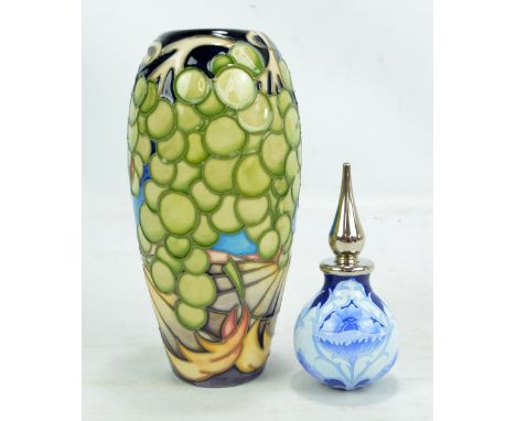 MOORCROFT; an ovoid grapes decorated vase, inscribed 'P.T. Trial 24.7.03' to base with impressed marks, height 19cm, also a b