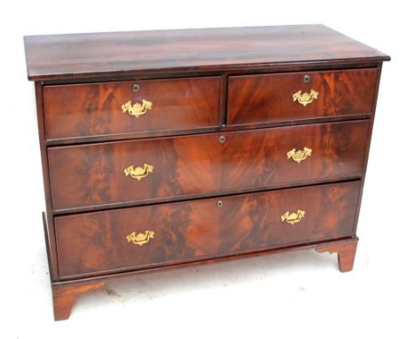 An early 20th century mahogany chest of two short above two long drawers with brass handles, on ogee bracket feet, width 125c