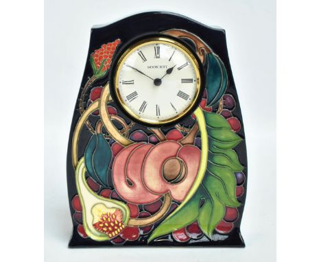MOORCROFT; a tubeline decorated 'Queen's Choice' pattern mantel clock by Emma Bossons, set with Roman numerals, impressed mar