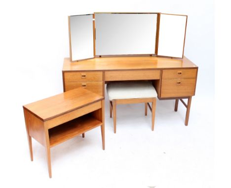 An Alfred Cox Batik kneehole dressing table, width 137cm, with matching bedside table and stool (3).