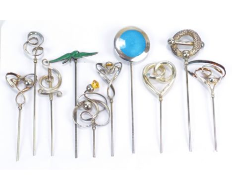 CHARLES HORNER; ten various hallmarked silver hat pins including a hinged circular blue guilloche enamel decorated example, C