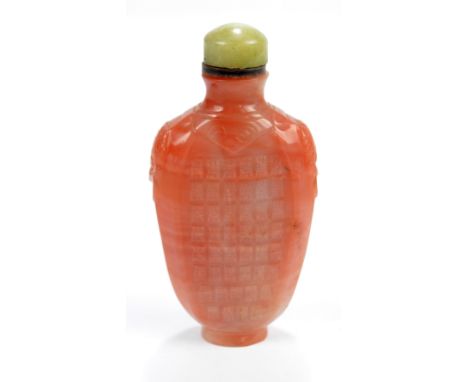 A Chinese pale orange agate snuff bottle of flat ovoid form decorated with formation of auspicious character marks to each si