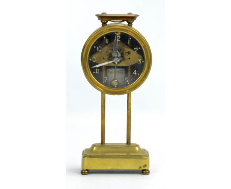 A brass rise and fall clock, the glass with painted Arabic numerals, height 24cm.