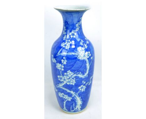 A large late 19th/early 20th century Chinese porcelain vase of ovoid form with flared rim, painted in underglaze blue with bl