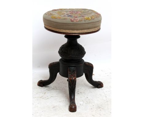 A Victorian revolving piano stool.